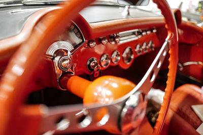 Vintage racing automobile steering wheel and dashboard