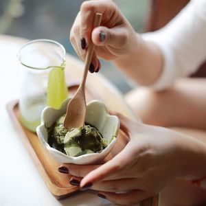 Cropped image of woman having ice cream