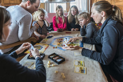 Family playing board game