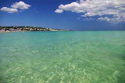 Scenic view of sea against cloudy sky