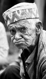 Portrait of senior man wearing hat outdoors