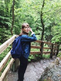 Woman standing in forest