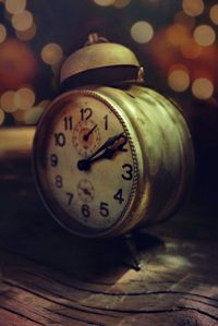 Close-up of clock on table