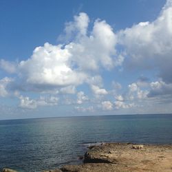 Scenic view of sea against cloudy sky