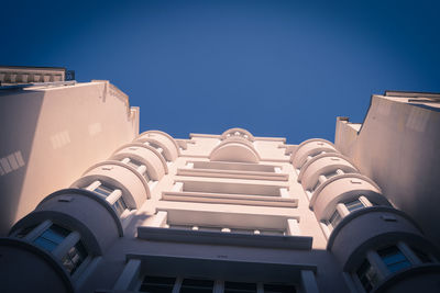 Low angle view of building against blue sky