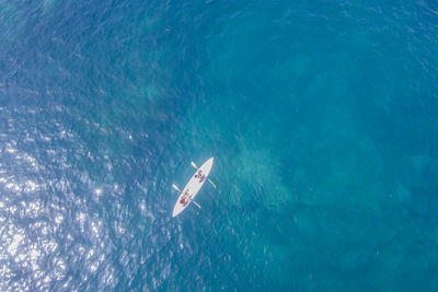 Aerial view of boat on sea during sunny day