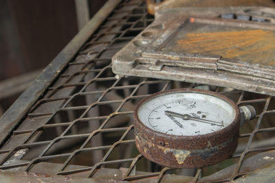 High angle view of old machine part on wood