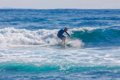 Man surfing in sea