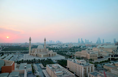 Panoramic aerial view of manama with the al fateh grand mosque against pastel color sunset sky