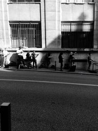 People walking on street in city
