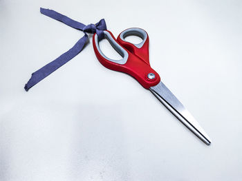 High angle view of metallic structure on table against white background