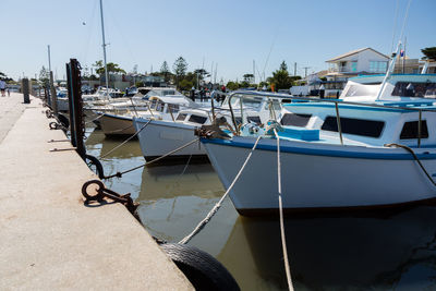 Boats moored at harbor