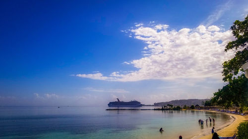 Scenic view of sea against blue sky
