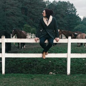 Woman standing on grass