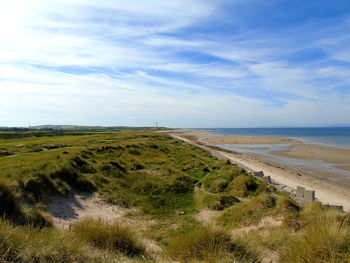 Scenic view of beach against sky