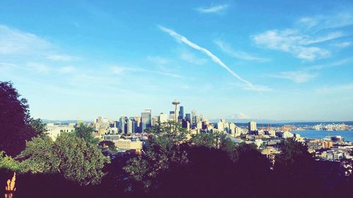 City skyline against blue sky