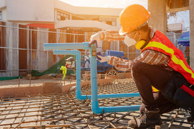 Side view of man working in park