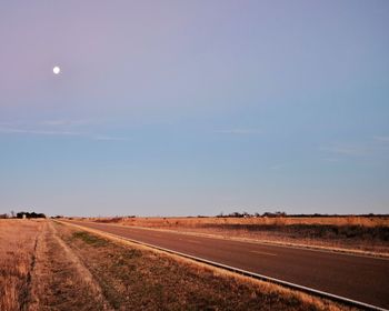 Road passing through field