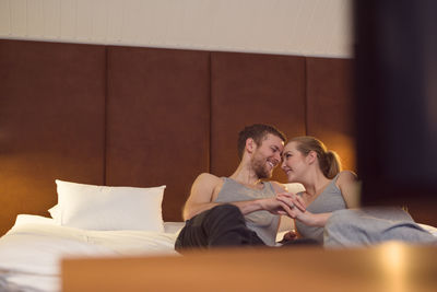 Loving couple chilling on bed