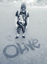 High angle view of boy standing with text