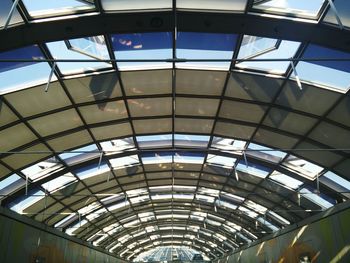 Low angle view of curved glass ceiling