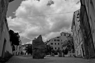 Street amidst buildings against sky