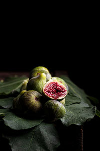 Close-up of strawberry over black background