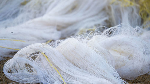 High angle view of fishing nets on sand