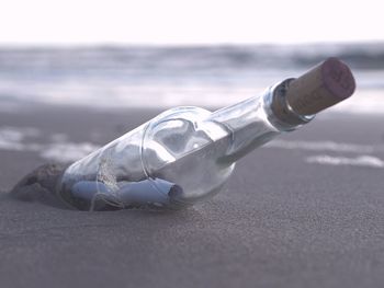 Close-up of bottle against sky