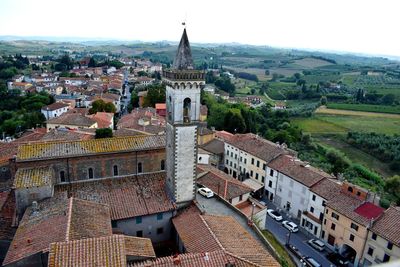 High angle view of buildings in town against sky