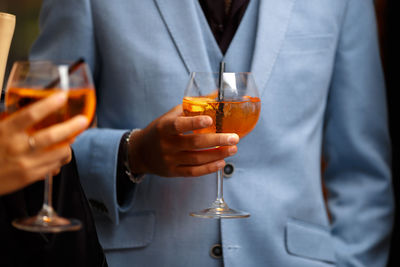 Close-up of a man drinking glass