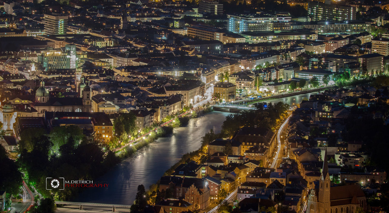 illuminated, night, cityscape, city, aerial view, travel destinations, architecture, building exterior, outdoors, skyscraper, modern, city life, urban skyline, no people, downtown district, drone