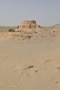 Scenic view of desert against clear sky