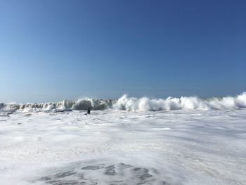 Scenic view of sea against clear sky during winter