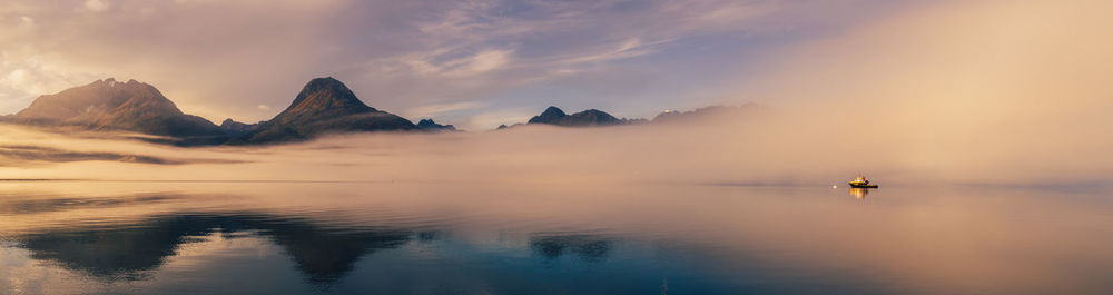 Scenic view of lake against sky during sunset