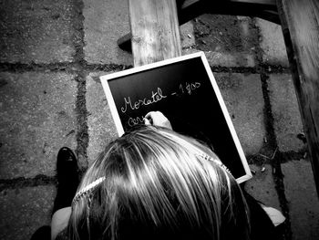 High angle view of writing on slate bench