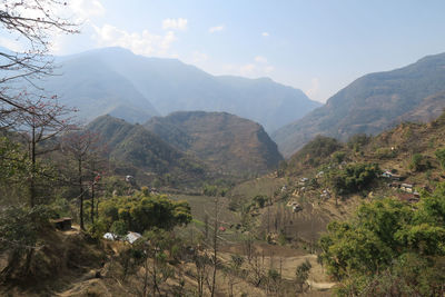 High angle view of trees and mountains against sky