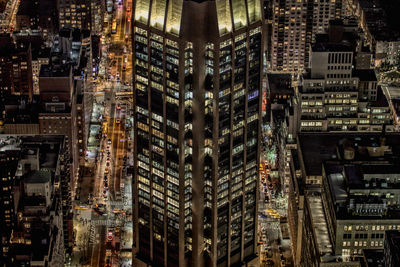 Aerial view of buildings in city at night