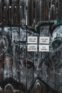 Close-up of text on glass window