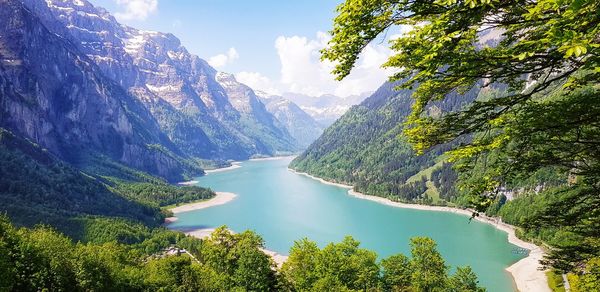 Scenic view of lake and mountains against sky