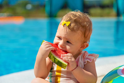 Portrait of boy playing with inflatable ring