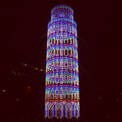 Low angle view of illuminated lights at night