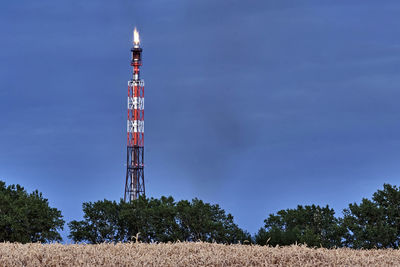 Low angle view of communications tower against sky