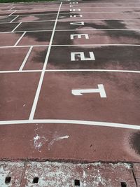 High angle view of arrow symbol on road