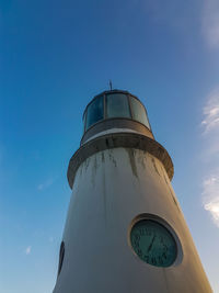 Low angle view of clock tower against sky