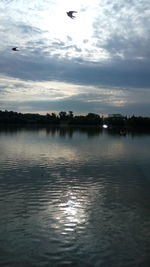 Scenic view of lake against sky during sunset