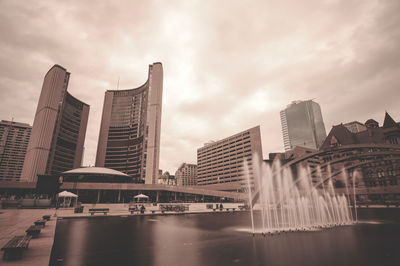 Modern buildings against sky in city