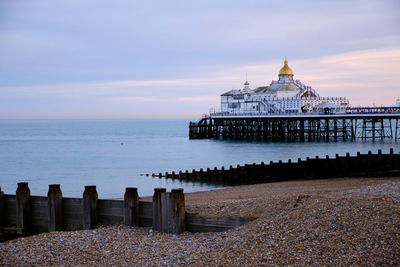 Dusk at eastbourne pier in east sussex on the south coast of england