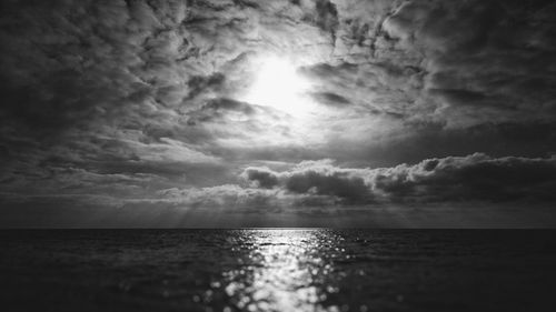 Scenic view of sea against cloudy sky