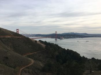 Bridge over sea against sky